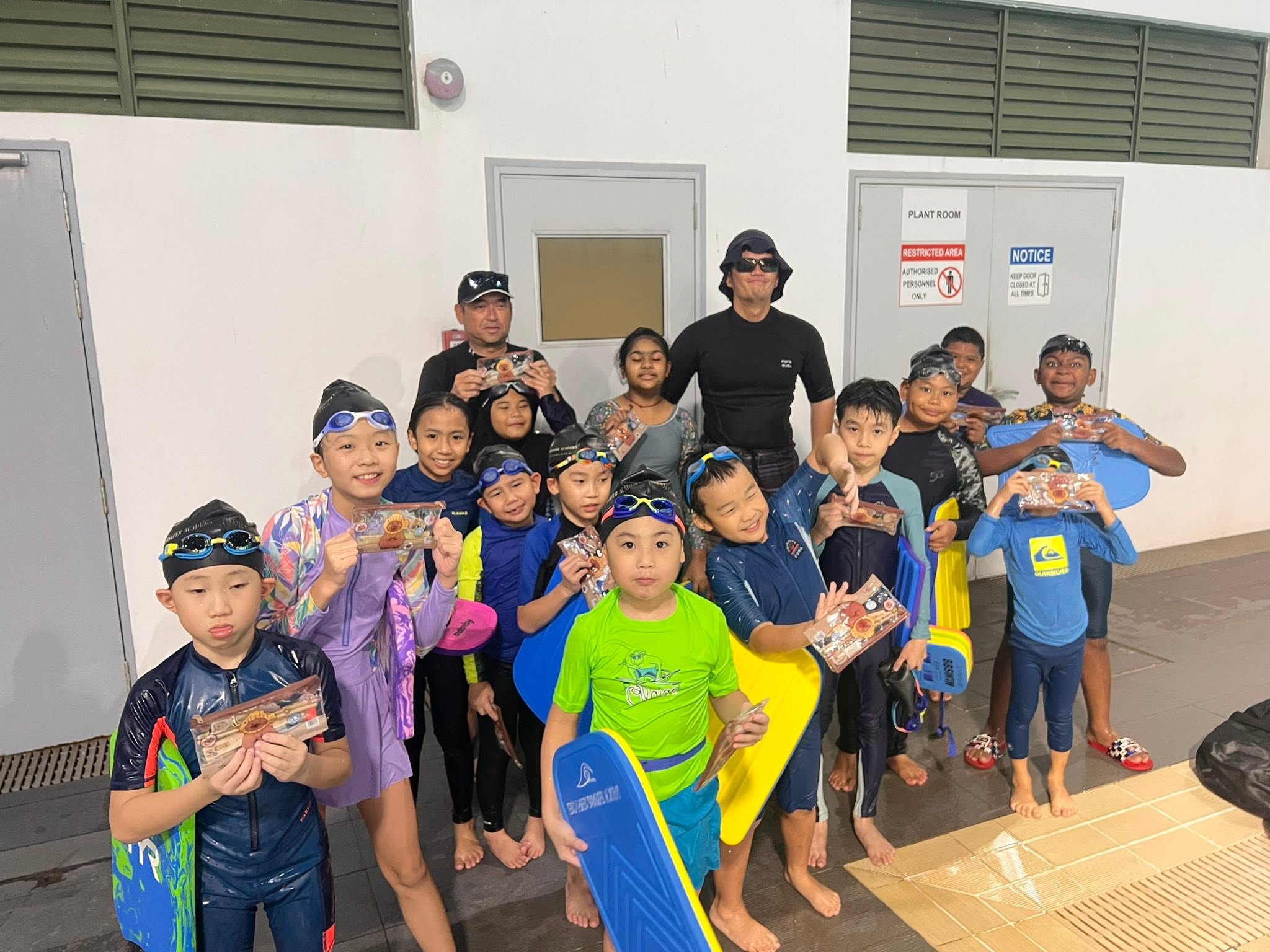 Young swimmers enjoying their lesson