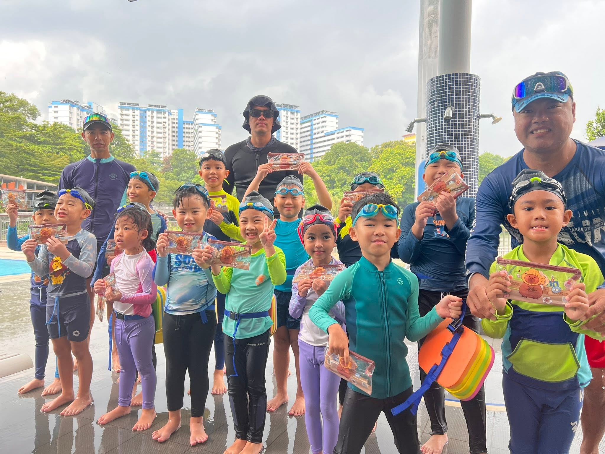 Instructor supporting students in the water
