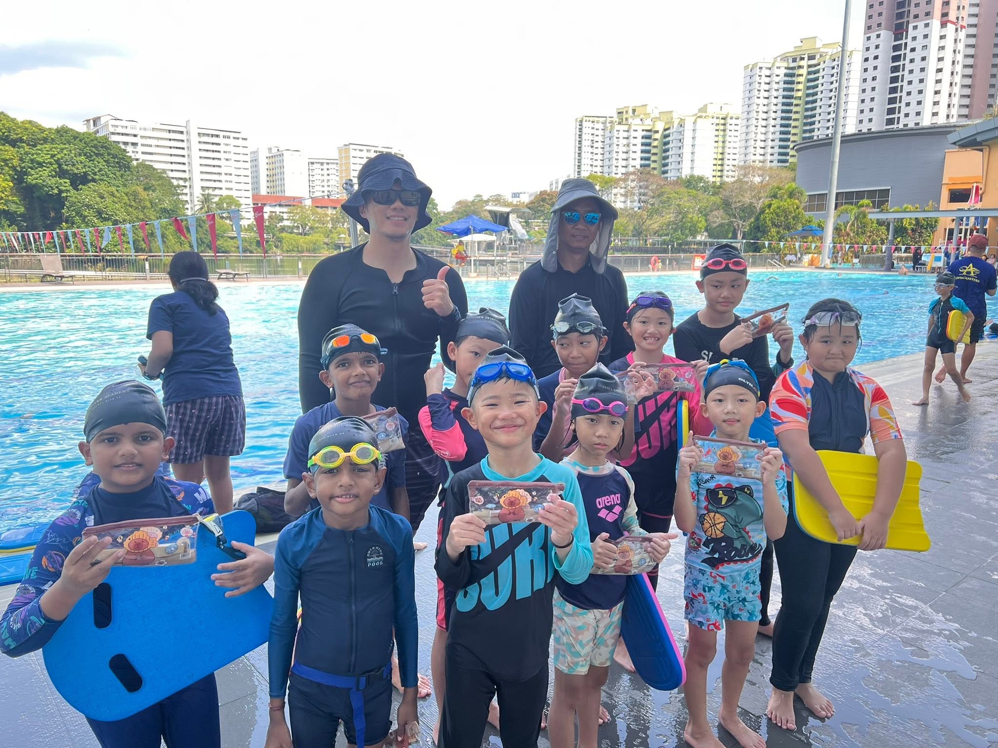 Swimmers working on their pool skills