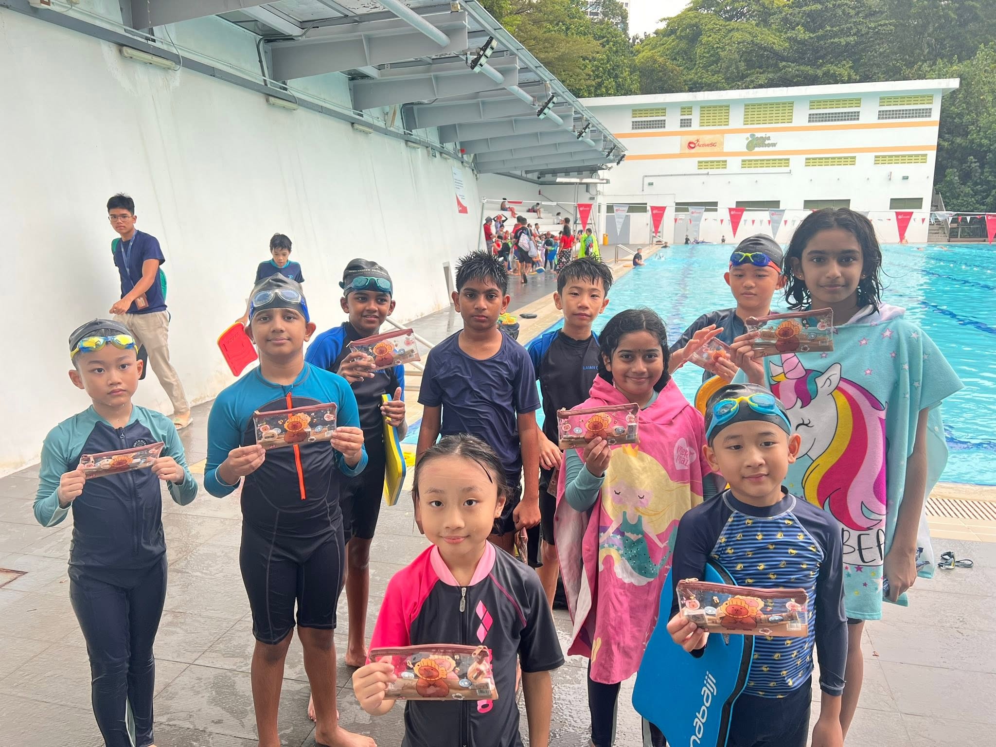 Swimmers practising pool skills